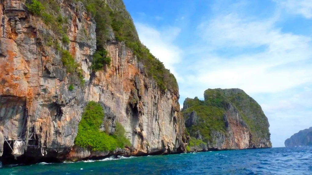 Sheer rock walls of Phi Phi island above deep blue water